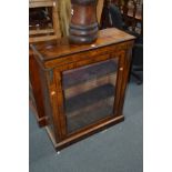 A LATE VICTORIAN WALNUT, STRUNG AND FOLIATE INLAID PIER CABINET, glazed single door with brass