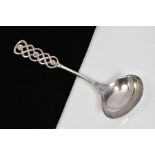 A SCANDINIAVIAN DAVID ANDERSEN LADLE SPOON, the graduated terminal of interlocking knot design, with