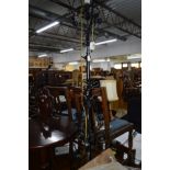 A 20TH CENTURY BLACK GROUND WROUGHT IRON TELESCOPIC STANDARD LAMP with foliate and scrolled