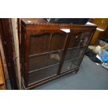 A MAHOGANY CHINA CABINET with two glazed doors standing on cabriole legs, width 124cm x height 115cm