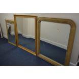A LATE 20TH CENTURY GOLDEN OAK OVERMANTEL MIRROR, 100cm x 120cm together with a modern pine wall