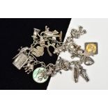 A CHARM BRACELET, the curb link bracelet suspending twenty three charms, to include a Popeye charm