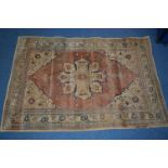 A LATE 19TH/EARLY 20TH CENTURY TURKISH SILK RUG, in poor condition, pink and ivory ground, central