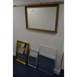 A MODERN FOLIATE RECTANGULAR BEVELLED EDGE WALL MIRROR together with three other wall mirrors (4)