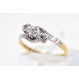 A THREE STONE DIAMOND RING, designed as a diagonal line of graduated brilliant cut diamonds within