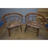 A PAIR OF 19TH CENTURY AND LATER OAK AND ELM CHILDS ARMCHAIRS with an arched spindled back