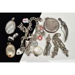 A SELECTION OF SILVER AND WHITE METAL JEWELLERY, to include a charm bracelet, three lockets, a