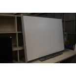 A SMART TECH SB650 77'' SMARTBOARD with pen tray and four pens