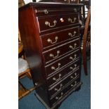 A MODERN MAHOGANY CHEST OF SEVEN DRAWERS with brushing slide and brass swan necked handles