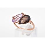 A 9CT GOLD GEM SET RING, designed with a pear cut smoky quartz and amethyst to the plain polished