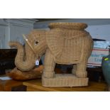 A VINTAGE WICKER OCCASIONAL TABLE in the form of a elephant