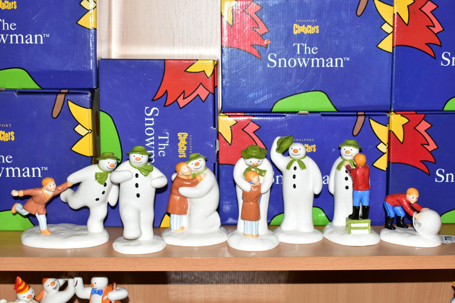 SEVEN BOXED COALPORT THE SNOWMAN CHARACTER FIGURES, 'Building the Snowman', 'Adding A Smile', 'The