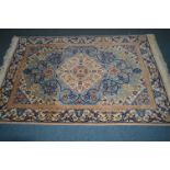 A LARGE WOOLLEN FLORAL GREEN GROUND CARPET SQUARE, 435cm x 293cm, together with woollen floral