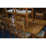 AN EARLY 20TH CENTURY ARTS AND CRAFTS GOLDEN OAK WIND OUT DINING TABLE, canted corners, Joseph