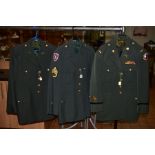 THREE ITEMS OF US FORCES WWII ERA UNIFORMS, two jackets and trousers, uniform caps with Eagle