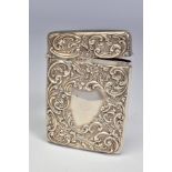AN EDWARDIAN SILVER CARD CASE OF RECTANGULAR FORM, repousse decorated with foliate scrolls, vacant