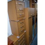 A MODERN EIGHT PIECE BEDROOM FITMENT including wardrobes, chest of drawers and headboard with