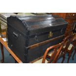 A VINTAGE OAK BOUND DOMED TOPPED TRUNK with an internal tray, width 84cm x depth 51cm x height