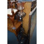 AN ART NOUVEAU BRASS AND WROUGHT IRON TELESCOPIC OIL LAMP with a etched glass shade, height 154cm