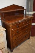 A VICTORIAN MAHOGANY CHIFFONIER/CHEST OF TWO SHORT AND THREE LONG GRADUATING DRAWERS on double bun