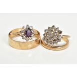 FOUR 9CT GOLD RINGS, to include an amethyst and cubic zirconia oval cluster ring, ring size M, cubic