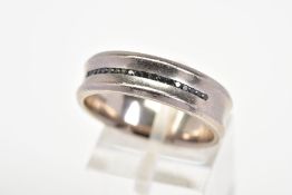 A MODERN 18CT WHITE GOLD AND BLACK DIAMOND BAND RING, estimated black diamond weight 0.10ct, a