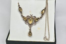 A CITRINE NECKLACE, the front panel designed as a triangular scrolling panel collet set with pear