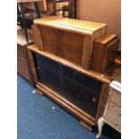 AN EARLY TO MID 20TH CENTURY WALNUT ART DECO BOOKCASE, with a pair of hinged side openings