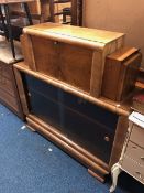 AN EARLY TO MID 20TH CENTURY WALNUT ART DECO BOOKCASE, with a pair of hinged side openings