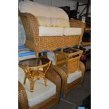 A FOUR PIECE CONSERVATORY SUITE, comprising a two seater settee, two armchairs and a coffee table,