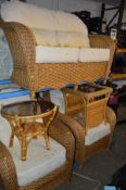 A FOUR PIECE CONSERVATORY SUITE, comprising a two seater settee, two armchairs and a coffee table,