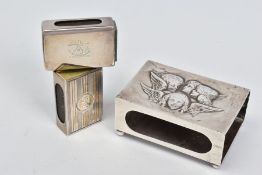THREE SILVER MATCH BOX COVERS, the largest repousse decorated with Reynolds Angels, on four ball