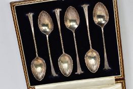 A CASED SET OF SIX SILVER TEASPOONS, each with shell design bowls, twisted stems and tapered