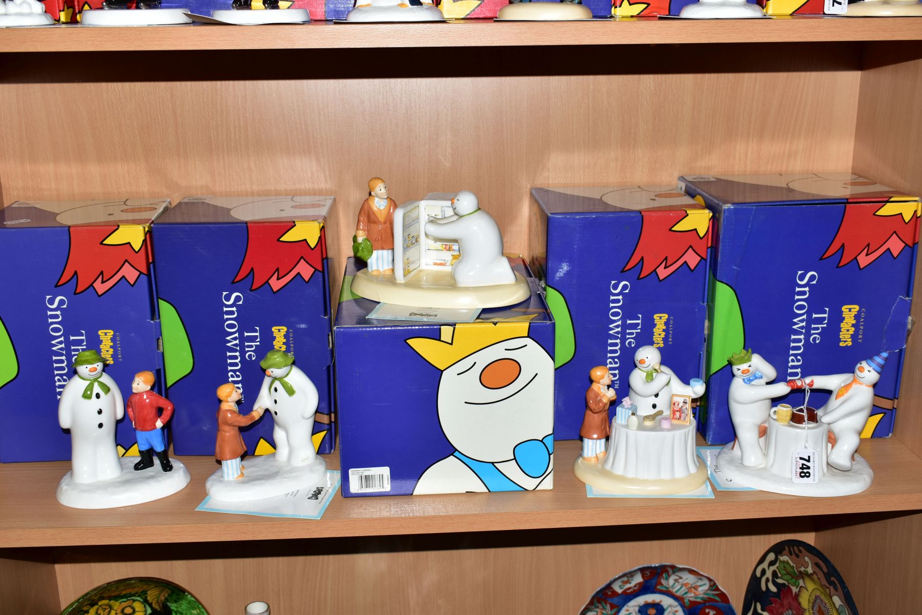 FIVE BOXED COALPORT THE SNOWMAN CHARACTER FIGURES, exclusively to H. Samuel, 'Pulling a Cracker' (