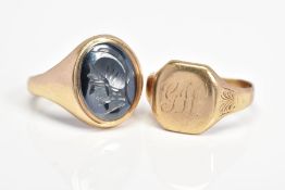 A 9CT GOLD HEMATITE SIGNET RING and one other, the hematite ring depicting a soldier in profile,