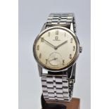 A HAND WOUND STAINLESS STEEL OMEGA WRISTWATCH, silvered dial, degraded with age, Arabic numerals and