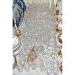 A GROUP OF CUT GLASS, to include brandy glasses, wines, candlesticks, tumblers, etc