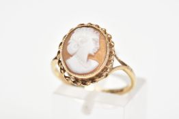 A 9CT GOLD CAMEO RING, the oval cameo panel depicting a lady in profile within a rope twist surround