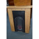 A MODERN PINE FIRE SURROUND with a cast iron insert and simulation lights in grate, width 90cm x