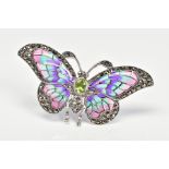 A PLIQUE-A-JOUR BUTTERFLY PENDANT/BROOCH, designed with an oval peridot body, purple, green and pink