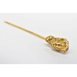 A NUGGET STICKPIN, the terminal designed as a textured gold nugget to the plain pin, tests as