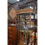 AN EDWARDIAN CIRCULAR MAHOGANY CENTRE TABLE together with an oak barley twist firescreen with