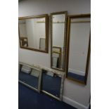A MODERN RECTANGULAR BEVELLED EDGE WALL MIRROR, 113cm x 88cm together with two long modern