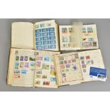 FOUR SMALL ALBUMS OF STAMPS WITH SOME COMMONWEALTH SPECIMEN OVERPRINTS