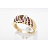 A DIAMOND AND RUBY RING, designed with four diagonal rows of round brilliant cut diamonds
