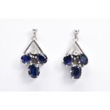 A PAIR OF SAPPHIRE DROP EARRINGS, each designed with three oval cut sapphires and a single brilliant