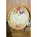 A ROYAL WORCESTER BLUSH IVORY TWIN HANDLED BOWL, moulded as basket weave with floral decoration,