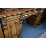 A VICTORIAN FLAME MAHOGANY PEDESTAL SIDEBOARD, carved foliate decoration, with a raised back,