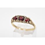 A 9CT GOLD GARNET BOAT RING, designed with three graduated circular garnets interspaced with