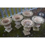 A SET OF FIVE COMPAGNA GARDEN URNS, with mythical creature decoration and twin handles, diameter